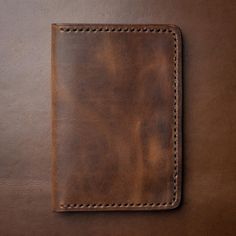 Our Brown Leather Passport Covers add a touch of professionalism to your travel kit. The rich character of Heritage Brown leather will age gracefully as it travels with you over the years. The dense yet supple feel of the leather will be a welcome warmth whenever you pull it out at the airport. Over time, this passport cover will become as indispensable as the contents inside. Our full-grain Horween leather means your passport cover will develop character and patina through your travels. We hand Classic Leather Rectangular Travel Accessories, Classic Leather Travel Accessories With Luggage Sleeve, Classic Vintage Brown Leather Wallet, Classic Leather Wallets For Everyday Use, Classic Travel Wallets, Classic Leather Travel Wallet, Classic Brown Travel Accessories For Business Trips, Leather Travel Wallet In Cognac, Brown Leather Wallet With Leather Lining