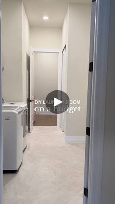 an empty hallway with washer and dryer on the other side is shown in this image