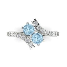 two blue and white diamond rings on top of each other with diamonds around the band