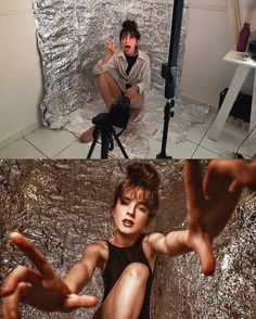 a man sitting on top of a chair in front of a silver foil covered backdrop