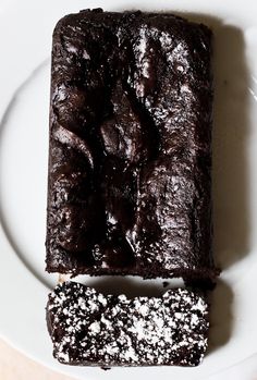 two pieces of chocolate cake on a white plate