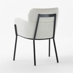 a white chair with black legs and arms