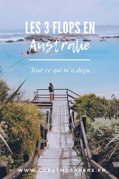 a woman standing on top of a wooden walkway next to the ocean with text overlay reading les 3 flopsen austrie