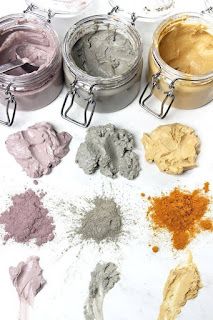 several different types of powders in metal containers