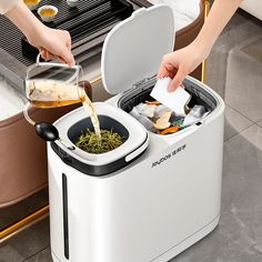 a person pouring tea into a white toaster