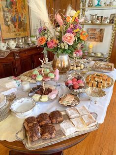 a table filled with lots of desserts and pastries