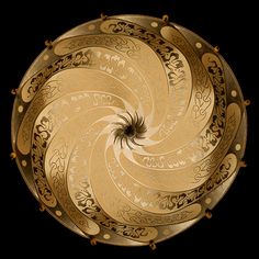 an intricately designed gold plate on a black background