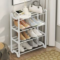 a white shoe rack with several pairs of shoes on it