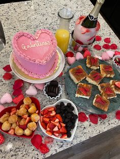 valentine's day desserts are arranged on a kitchen counter