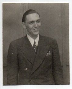 an old black and white photo of a man in a suit