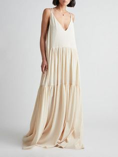 The Elegant Resort Deep V-Neckline Strappy Maxi Dress exudes sophistication and style. Designed with a deep V-neckline and strappy details, this dress is perfect for resort wear or special occasions. Its flowing silhouette and subtle beige color enhance its elegant appeal. Details: Material: PolyesterFit Type: Loose FitThickness:RegularStyle:Casual,Vacation @Note:Size: please check measurements carefullyPlease allow 0.5-1" difference due to manual measurementDifferent monitor settings means colo Cotton Camisole, Strappy Maxi Dress, Gaun Fashion, Long Beach Dress, Elegant Maxi Dress, Camisole Dress, Camilla And Marc, Suspender Dress, Side Splits