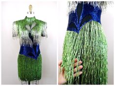 "This is an EXQUISITE little vintage dress beautifully detailed and hand beaded with fringed beading all over! It's in perfect condition! Bust - 33\" Waist - 27\" Hips - 36\" Length - 33\"  This dress comes from a pet-free and smoke-free home. If you would like more info or have any questions, please don't hesitate to ask!" Fitted Flapper Dress With Tassels For Cocktail, Fitted Beaded Fringe Flapper Dress For Party Season, Fitted Flapper Dress With Rhinestone Fringe For Cocktail, Fitted Sequin Dress With Fringe For Summer, Beaded Mini Dress, Embellished Wedding Dress, Art Deco Dress, Exquisite Gowns, Vintage Gowns