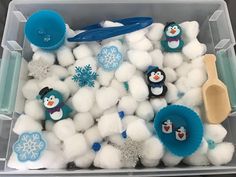 a plastic container filled with cotton balls and snowmen