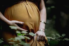 a pregnant woman's hand on her belly