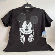 Measurements Armpit To Armpit Approximately 19” Shoulder To Hem 26” Black Disney Fan Merchandise T-shirt, Disney Black T-shirt With Character Print, Black Disney T-shirt For Fan Events, Black Disney Character Print T-shirt, Black Disney Tops With Cartoon Print For Fan Events, Black Mickey Mouse Tops For Disney Events, Black Disney Graphic Tee, Black Mickey Mouse Top For Disney Fan Events, Black Tops With Cartoon Print For Disney Fan Events