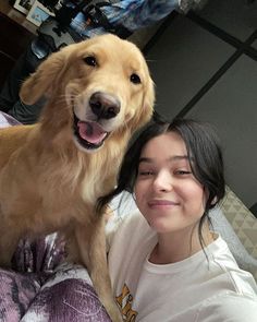 a girl and her dog posing for the camera