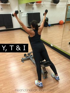 a woman is doing exercises on an exercise machine