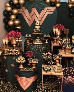 a table topped with lots of gold and black decorations