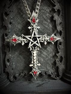 SPECIAL NOTE: This necklace is a new version of the pendant, so the pictures in the reviews from customers may be different than the actual product, as they have bought the old version of it. The buyer will receive the necklace which is pictured here, if you have any questions, contact me :)This Gothic cross with Pentagram is an handmade pewter sculpture This gothic necklace is sold with a free 24'' stainless steel chain, if you would like to have a different length for the chain, you can write Gothic Jewelry For Men, Vampire Prom, Gothic Cross Jewelry Gift, Handmade Gothic Cross Pendant Necklace, Gothic Cross Metal Jewelry, Cross Pendant Necklace Gothic, Gothic Cross Pendant, Satanic Jewelry, Inverted Cross