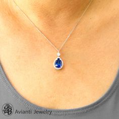 This timeless setting is an ideal showcase with a 3.77 Carat deep Blue violet Tanzanite. It comes with white gold chain in 18 and 16 inch option. If you would like a different size chain, please contact us for a price quote. [MATERIALS] Stone: Tanzanite (1) Carat : 3.10 Clarity: Clean Color: Violet blue Cut: Pear Setting: Prong Measurement of stone: 6.50 mm x 9.00 mm Stones: Diamonds (21) Carat : 0.25 Clarity: SI1 Color: I-J Cut: Round Setting: Pave Metal: 4.30 Grams of 14kt White Gold [ORDERS] Elegant Pear-shaped Gemstones For Formal Occasions, Elegant Pear-shaped Gemstones For Anniversary, Elegant Tanzanite Gemstones With Accent Stones, Elegant Sapphire Gemstones With Halo Setting, Elegant Teardrop Gemstones For Anniversary, Elegant Sapphire Pear-shaped Necklace, Elegant Pear-shaped Sapphire Necklace, Elegant Sapphire Gemstones With Brilliant Cut, Elegant Brilliant Cut Sapphire Gemstones