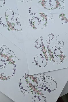 four sheets of paper with floral designs on them and the words love written in cursive writing