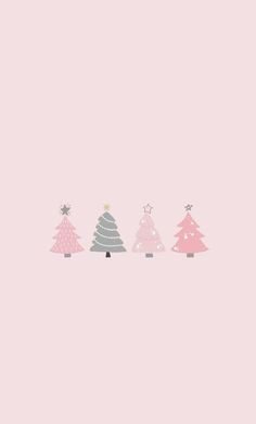 three christmas trees in different colors on a pink background