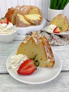 a bundt cake with whipped cream and strawberries on the plate next to it