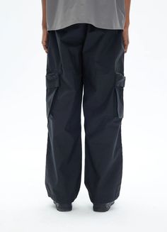 Paratrooper Style Quick-Dry Cargo Pants - Achieve ultimate comfort and style with these quick-dry cargo pants, designed with a paratrooper style. Featuring an elastic waistband, 3D cut, layered seams on the knees, and adjustable drawstring hem. These pants come with cargo pockets and a light dice print IT logo on the back. Made from durable polyester fiber, they are perfect for all-day wear. Available in black and recommended to size up as they run small. See the size chart below for detailed me Full Length Parachute Pants With Cargo Pockets For Outdoor, Full Length Outdoor Parachute Pants With Cargo Pockets, Outdoor Full-length Parachute Pants With Cargo Pockets, Black Cargo Style Hiking Pants, Black Cargo Pants For Hiking, Cargo Pants With Functional Pockets For Outdoor Activities, Black Cargo Hiking Pants, Outdoor Full-length Parachute Pants With Multiple Pockets, Black Cargo Style Hiking Bottoms