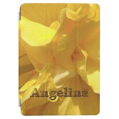 an ipad case with the word, angellia in black lettering on it and a yellow flower