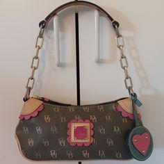 Dooney & Bourke Baguette Vintage Y2 Shoulder Bag Multi Color Hit The Offer Button. Low Ball Offers And Likes Will Not Be Considered. Serious Buyers Only. Thanks Adorable Bag. Excellent Vintage Condition. Y2k. One Owner. Super Clean, Not Flaws. A Collector's Dream. Vintage Dooney Leather Heart Charm. Y2k Pink Leather Top Strap. Chain Link Strap. 100& Leather Exterior, Fabric Interior. No Marks Or Stains, However The Interior Could Use A Minor Cleaning. . Vintage, Y2k, 90's, Leather, Dooney Shoulder Bag Vintage, Leather Heart, Y2k Pink, Dooney & Bourke Bags, Dooney & Bourke, Super Clean, Cute Bags, Women Accessories Bags, Pink Leather