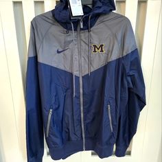 Brand New Never Worn Nike University Of Michigan Wolverines Windrunner Windbreaker Wolverines Full Zip-Up Jacket College Football Gear Mens Size Medium. Embroidered M Logo. Side Zip Pockets And Hood. Navy Blue And Grey. Perfect For U Of M College Students And Fans. Authentic Liscened Merchandise U Of M, University Of Michigan Wolverines, M Logo, Football Gear, University Of Michigan, Michigan Wolverines, Blue And Grey, New Nike, College Football