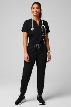 Empower Scrub Jumpsuit Fabletics black female Activewear >> Scrubs >> Jumpsuits MotionTech regular Esthetician Uniform Fashion, Esthetician Outfit Spa Uniform, Black Scrubs Outfit, Fabletics Scrubs, Scrub Jumpsuit, Cute Scrubs Outfits, Physical Therapist Outfit, Scrubs Uniform Cute, Therapist Outfit