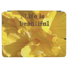 a yellow flower with the words life is beautiful on it