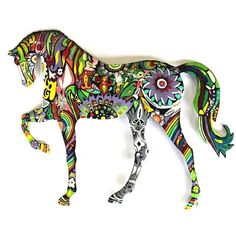 a metal horse with colorful designs on it's body and tail, standing in front of a white background