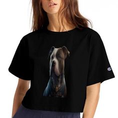 a woman wearing a black shirt with a dog on it