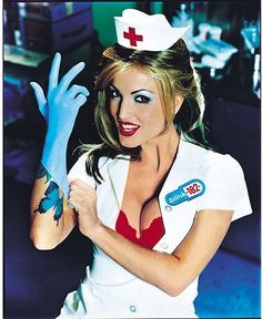 a woman in a nurse costume holding up her hand