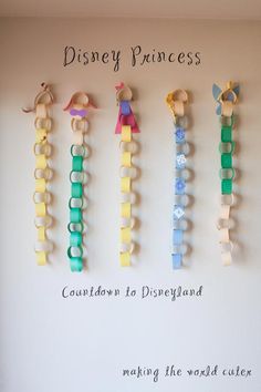 the disney princess wall hangings are made out of lego blocks and plastic clips, with text reading'disneyland princess caution to disneyland making the world cuteest