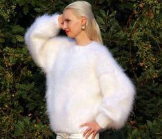 "FUZZY HAND KNITTED MOHAIR SWEATER by SuperTanya Hand knitted with love and care for your comfort and complete satisfaction. Its clear and plain design makes this warm and breathable fashion cloth suitable for any occasion. Wherever you are, the lovely white color will make you feel like a star. At office, shopping center or at home - you will be the \"only one\", around. With the crew neckline style you will fully comply with the fashion trends for the upcoming season. This premium quality, han White Soft Knit Winter Sweater, Oversized White Soft Sweater, Cozy Soft Knit White Sweater, White Cozy Soft Knit Sweater, Cozy White Soft Knit Sweater, Winter White Soft Texture Sweater For Winter, Winter White Soft Sweater For Winter, Winter White Soft Texture Sweater, Cozy White Sweater With Soft Texture