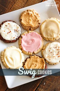 cookies with frosting and sprinkles on a white plate