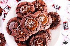 a white plate topped with chocolate cookies covered in sea salt