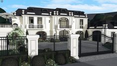 this is an artist's rendering of a large white house with black roof and gate