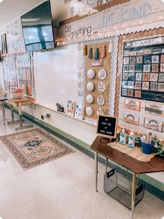 a classroom with many items on the wall and tables in front of it that are decorated with magnets