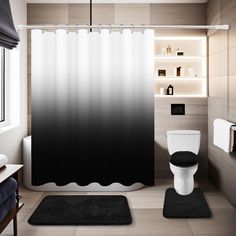 a bathroom with a black and white ombreed shower curtain next to a toilet