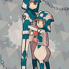 two people standing next to each other with chains around them and one person wearing a helmet