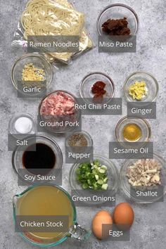 the ingredients to make chicken noodle soup laid out in bowls on a gray background