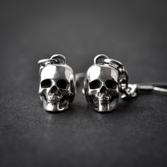 Handmade sterling silver 925 hung 3D skull earrings. Each earring is cleaned and polished with care. Approx weight: 2.75gr (each) Skull hight: 11.64mm Skull width: 8mm The earring is made of sterling silver 925 and is water resistant. *The listing is for ONE earring Here are some listings that you might also love: https://www.etsy.com/il-en/listing/560249661/skull-necklace-silver-skeleton-skull https://www.etsy.com/il-en/listing/528268224/skull-nacklace-sterling-silver-silver https://www.etsy.co Gothic Sterling Silver Jewelry With Skull Print, Nickel Free Sterling Silver Skull Ring, Nickel-free Sterling Silver Skull Ring, Gothic Sterling Silver Skull Earrings, Silver Skull Earrings With Skull Print, Nickel-free Sterling Silver Skull Jewelry, Silver Skull Earrings For Pierced Ears, Skull Shaped Metal Earrings, Silver Skull Earrings With Ear Wire