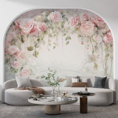 a living room with flowers painted on the wall and couches in front of it