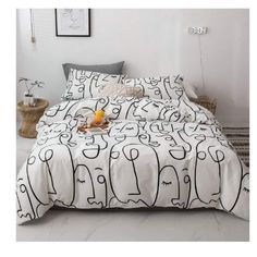 a bed with black and white designs on it