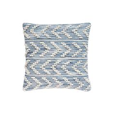 a blue and white pillow on a white background