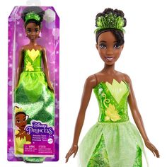 the princess and the frog doll is in its green dress with tiara on her head